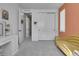 Comfortable bedroom features a built-in closet, a comfy yellow couch, and a workspace at 8728 Hotchkiss St, Littleton, CO 80125