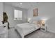 Bright bedroom with neutral tones, a cozy bed, and stylish decor at 8728 Hotchkiss St, Littleton, CO 80125