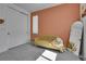 Stylish bedroom features a comfortable couch, a full-length mirror, and a built-in closet at 8728 Hotchkiss St, Littleton, CO 80125