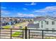 Scenic view from the balcony showcases the charming neighborhood and distant mountains at 8728 Hotchkiss St, Littleton, CO 80125
