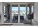 Covered patio with dining set showcases scenic neighborhood and mountain views at 8728 Hotchkiss St, Littleton, CO 80125