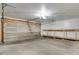 Garage with concrete floor, shelving, and automatic door at 3300 W Florida Ave # 26, Denver, CO 80219