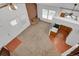 Bright living room features a brick fireplace and large windows offering plenty of natural light at 3300 W Florida Ave # 26, Denver, CO 80219