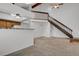 Spacious living area with an open staircase, skylight, and convenient access to the kitchen at 3300 W Florida Ave # 26, Denver, CO 80219