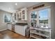 Well-lit kitchen featuring stainless steel appliances, granite countertops, and mountain views at 7515 Pineridge Trl, Castle Pines, CO 80108