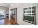 Kitchen with stainless steel appliances and white cabinets by a glass door and breakfast nook at 7515 Pineridge Trl, Castle Pines, CO 80108