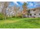 Large grassy backyard with a patio and grill for outdoor entertaining at 387 Upham St, Lakewood, CO 80226
