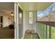 Balcony with view of bedroom, and an exterior view of green grass and trees at 387 Upham St, Lakewood, CO 80226