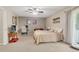 Cozy bedroom with a ceiling fan and a walk-out sliding door to the outside at 387 Upham St, Lakewood, CO 80226