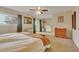 Inviting bedroom with carpet, complemented by a ceiling fan, window, and sliding door at 387 Upham St, Lakewood, CO 80226