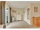 Comfortable bedroom featuring sliding glass doors, a ceiling fan, neutral walls, and carpet at 387 Upham St, Lakewood, CO 80226