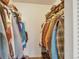 Walk-in closet showing organized hanging clothes and shelving for ample storage at 387 Upham St, Lakewood, CO 80226