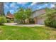 Well maintained two-story house with lush green front lawn and private drive at 387 Upham St, Lakewood, CO 80226