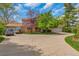 Charming home with a circular driveway and mature trees at 387 Upham St, Lakewood, CO 80226