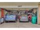 Attached two car garage full of storage and vehicles at 387 Upham St, Lakewood, CO 80226