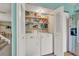 Conveniently located laundry closet with a washer and dryer for in-home laundry needs at 387 Upham St, Lakewood, CO 80226