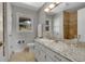 Bathroom showcasing granite countertops, updated fixtures, and decorative details at 258 Post Boy Rd, Boulder, CO 80302