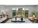Cozy living room with a sliding door to the balcony with mountain views at 258 Post Boy Rd, Boulder, CO 80302