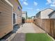 Cozy backyard featuring a concrete patio area, low-maintenance turf, and a wood fence for privacy at 4111 W Kenyon Ave, Denver, CO 80236