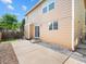 Spacious backyard patio ideal for outdoor dining, with a partially-fenced yard and convenient access to the home at 4111 W Kenyon Ave, Denver, CO 80236
