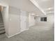Finished basement with neutral-colored walls, carpet flooring, and recessed lighting providing a functional living space at 4111 W Kenyon Ave, Denver, CO 80236