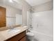 Bathroom with a shower-tub combination and vanity with granite countertop at 4111 W Kenyon Ave, Denver, CO 80236