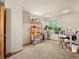 Bright bonus room or office featuring a window, workspace and comfortable carpeted floor at 4111 W Kenyon Ave, Denver, CO 80236