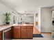 Features an open design and includes stainless steel appliances and an eat-in breakfast counter at 4111 W Kenyon Ave, Denver, CO 80236