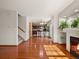 Open floor plan featuring hardwood floors, stairs, and view into the kitchen at 4111 W Kenyon Ave, Denver, CO 80236