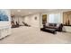Finished basement featuring workout equipment and a living area at 7099 E 123Rd Pl, Thornton, CO 80602
