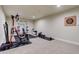 Basement exercise area with weightlifting and rowing equipment at 7099 E 123Rd Pl, Thornton, CO 80602