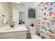 Charming ' bathroom featuring a vanity and a colorful shower curtain at 7099 E 123Rd Pl, Thornton, CO 80602