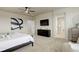 Bedroom with ensuite bath, television and plush neutral colored carpeting at 7099 E 123Rd Pl, Thornton, CO 80602