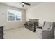 Cozy Bedroom with a crib, comfortable chair, and natural light at 7099 E 123Rd Pl, Thornton, CO 80602
