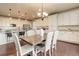 Open concept dining area with hardwood floors conveniently located next to the kitchen at 7099 E 123Rd Pl, Thornton, CO 80602