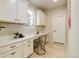 Bright office space with ample counter space, built-in cabinets, a window, and a neutral color palette at 7099 E 123Rd Pl, Thornton, CO 80602