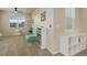 Bright playroom with plush carpeting, a sofa, and natural light from two windows at 7099 E 123Rd Pl, Thornton, CO 80602