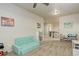 Playroom featuring neutral walls and carpeting, small sofa, and toy storage at 7099 E 123Rd Pl, Thornton, CO 80602