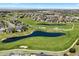 Aerial shot featuring a golf course community with ponds and manicured landscaping at 27290 E Nova Cir, Aurora, CO 80016