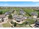 Aerial view of a luxurious home overlooking a golf course and neighborhood at 27290 E Nova Cir, Aurora, CO 80016