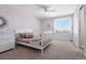 Charming bedroom with lilac walls, a white bed frame, and plenty of natural light at 27290 E Nova Cir, Aurora, CO 80016