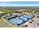Aerial view of community amenities, including tennis courts, pool, and clubhouse at 27290 E Nova Cir, Aurora, CO 80016