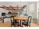 Dining room with natural light and an open view to living room with a beautiful fireplace at 27290 E Nova Cir, Aurora, CO 80016