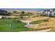 Scenic view of the golf course with lush fairways and sand traps; golf course living at its finest at 27290 E Nova Cir, Aurora, CO 80016