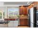 Kitchen with stainless steel appliances, granite countertops, and great natural light at 27290 E Nova Cir, Aurora, CO 80016