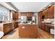 Spacious kitchen featuring an island, stainless steel appliances, and hardwood floors at 27290 E Nova Cir, Aurora, CO 80016