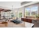 Spacious kitchen with stainless appliances, large island with cooktop, and eat-in dining area at 27290 E Nova Cir, Aurora, CO 80016