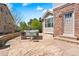 Large flagstone patio featuring outdoor seating and a fire pit, great for enjoying evenings outdoors at 27290 E Nova Cir, Aurora, CO 80016