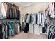 Organized walk-in closet with ample hanging space and shelving for storage at 27290 E Nova Cir, Aurora, CO 80016