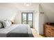 Cozy bedroom with door to balcony offers bright natural light and a spacious closet at 352 Apache Rd, Evergreen, CO 80439